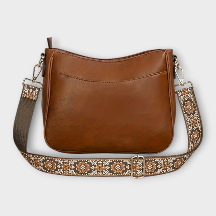 Boho-chic women's shoulder bag with intricate pattern on strap, ideal for summer outfits