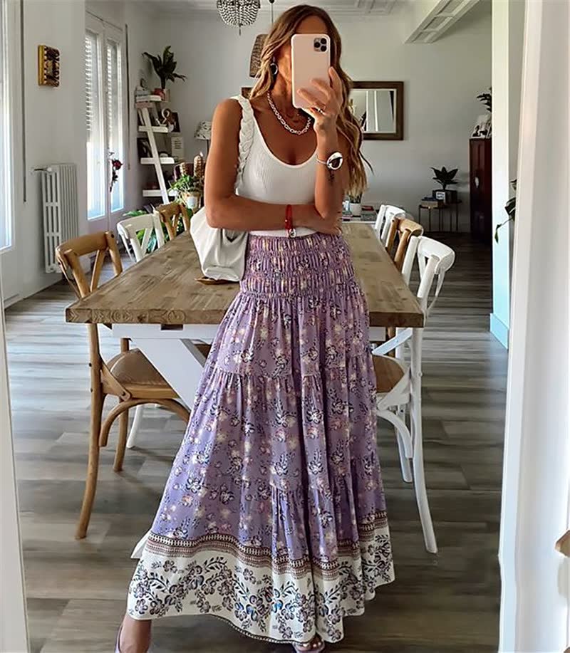 Lightweight women's tiered midi skirt with elastic waist, featuring a vibrant bohemian pattern for summer fashion.