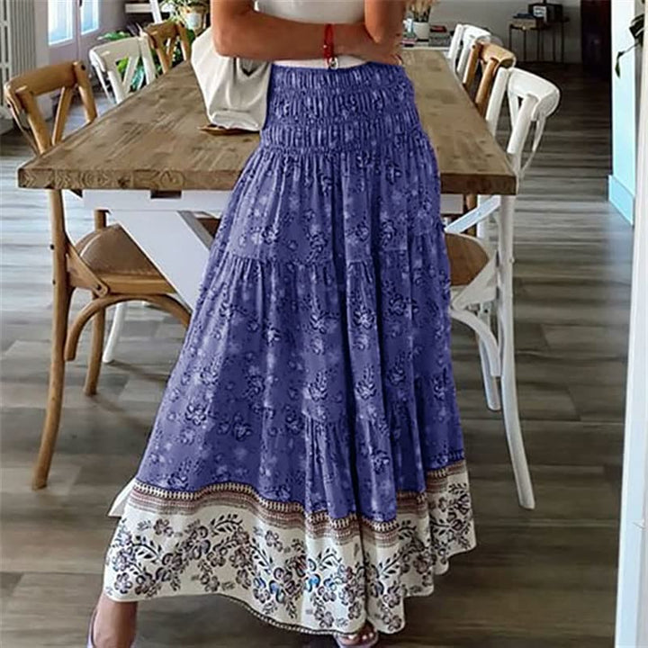 Elegant flowy tiered midi skirt for women, embodying bohemian summer style. Lightweight & perfect for movement.