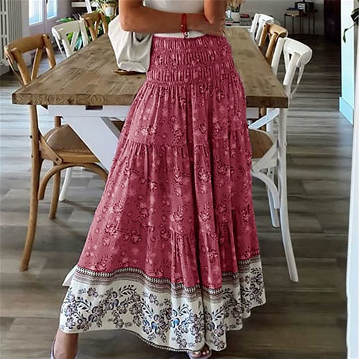 Bohemian tiered midi skirt for women, showcasing a beautiful pattern, elastic waist, & a flowing summer silhouette.