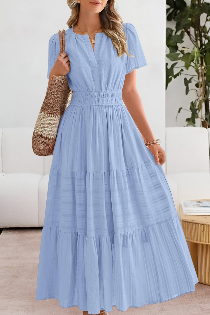 Women's boho midi summer dress in a relaxed, breathable fabric, an essential for vacation and beachwear.