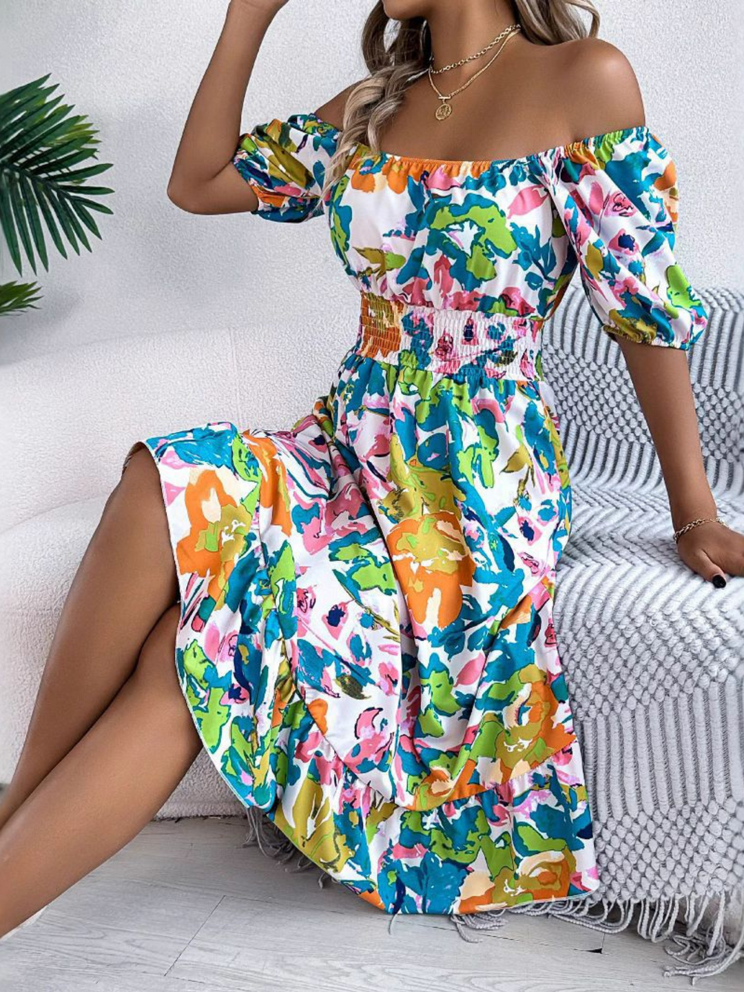 Green boho off-shoulder midi dress for women, featuring a vibrant floral print. Stylish and comfortable for summer.