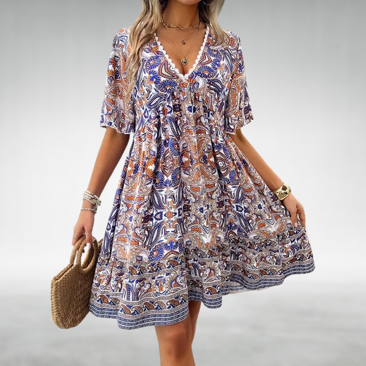 Boho style women's summer mini dress featuring an intricate paisley pattern and relaxed fit