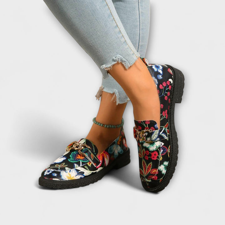 Women's bold multicolor loafers with vibrant abstract pattern, comfortable slip-on casual shoes.