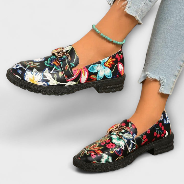 Close-up of women's multicolor loafers, showcasing the bold pattern and quality construction.