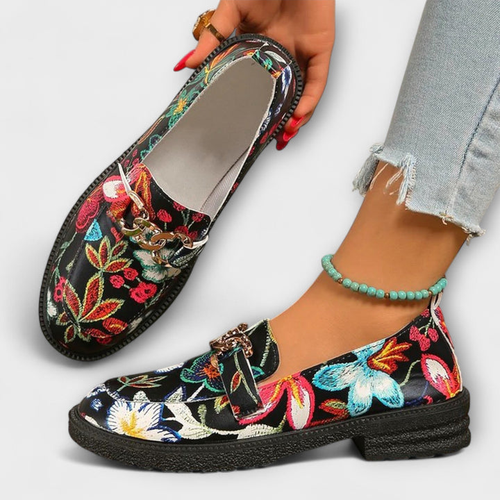 Women's comfort footwear: bold multicolor loafers with a distinct and fashionable slip-on design.
