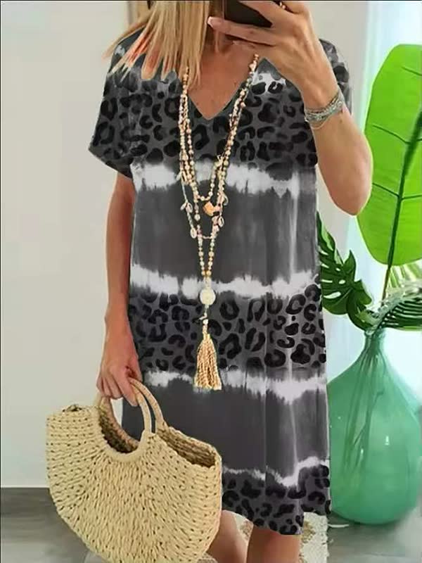 Bold print V-neck shift dress for women, offering a relaxed fit. Great short sleeve casual summer dress.