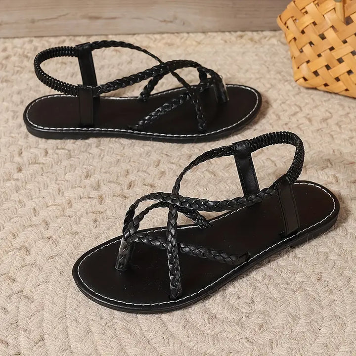 Close-up of the durable sole on women's braided flat sandals, suitable for daily wear