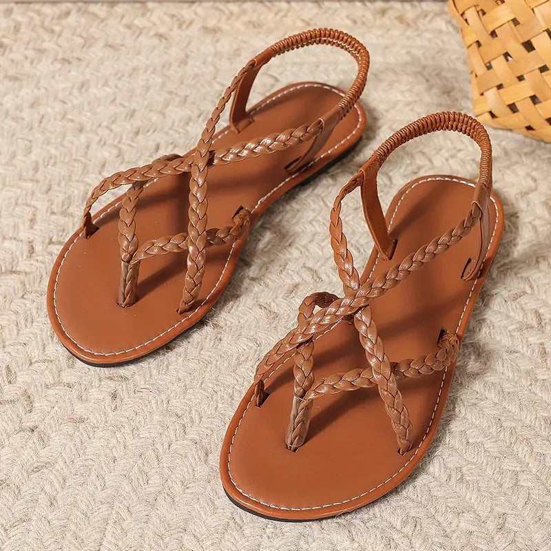 Women's braided flat sandals in a vibrant color, adding a pop to spring footwear