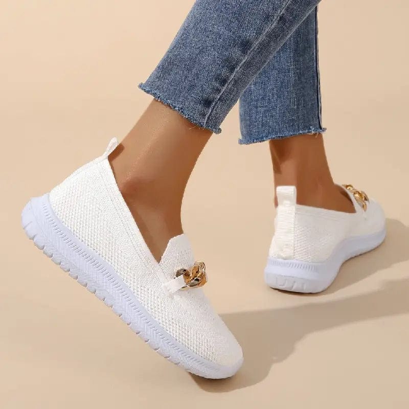 Side profile of women's breathable gray casual shoes, emphasizing comfort and mesh fabric