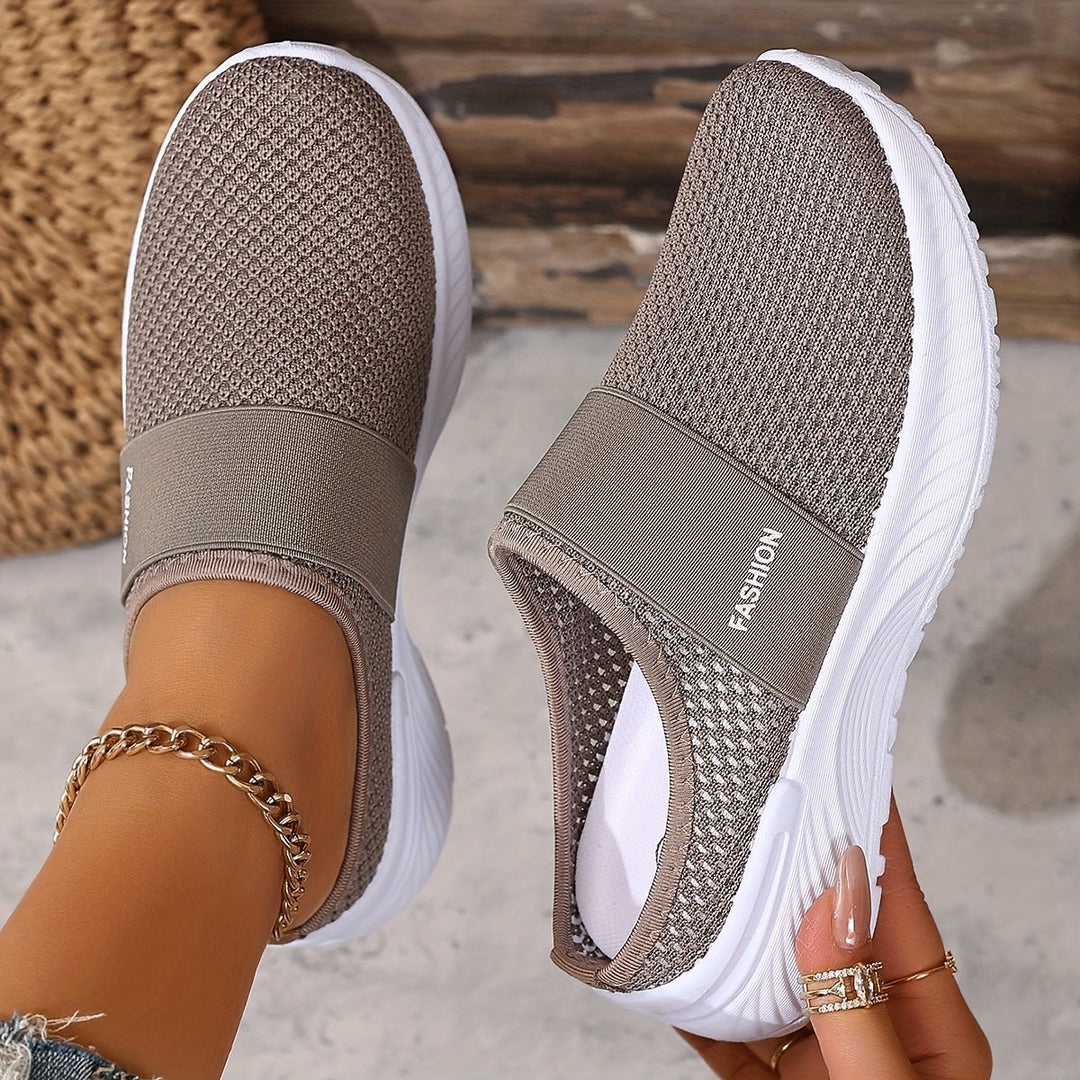 Stylish women's slip-on sneakers, breathable mesh for summer comfort & travel.