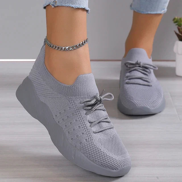 Red women's slip-on sneakers, breathable for ultimate comfort & stylish athleisure.