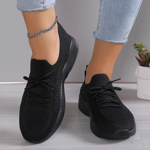 Gray lightweight slip-on sneakers for women, comfortable & breathable casual footwear.