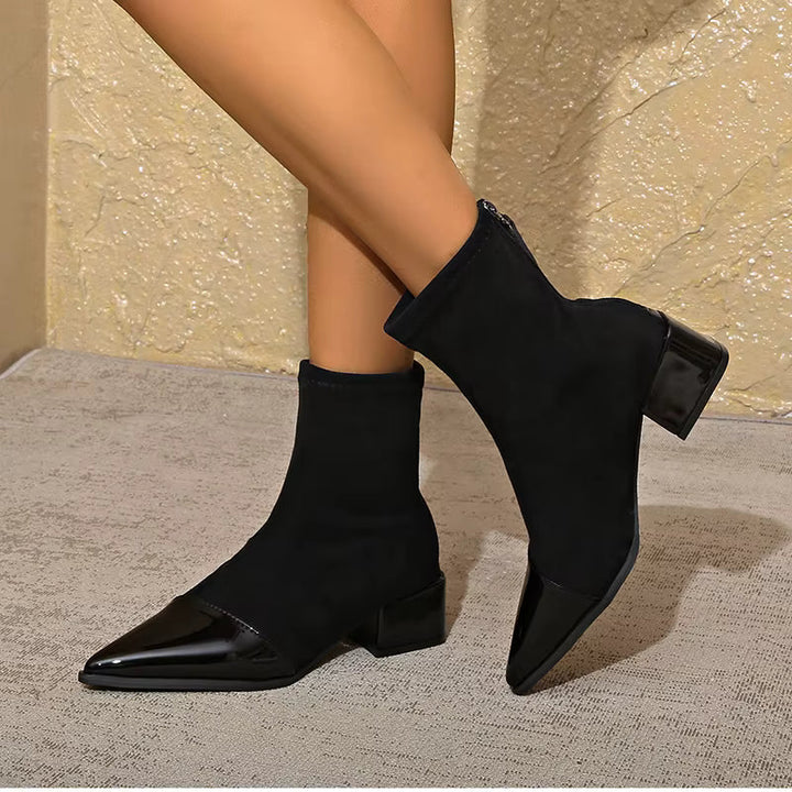 Black block heel ankle boots, a versatile and comfortable women's footwear staple for winter.