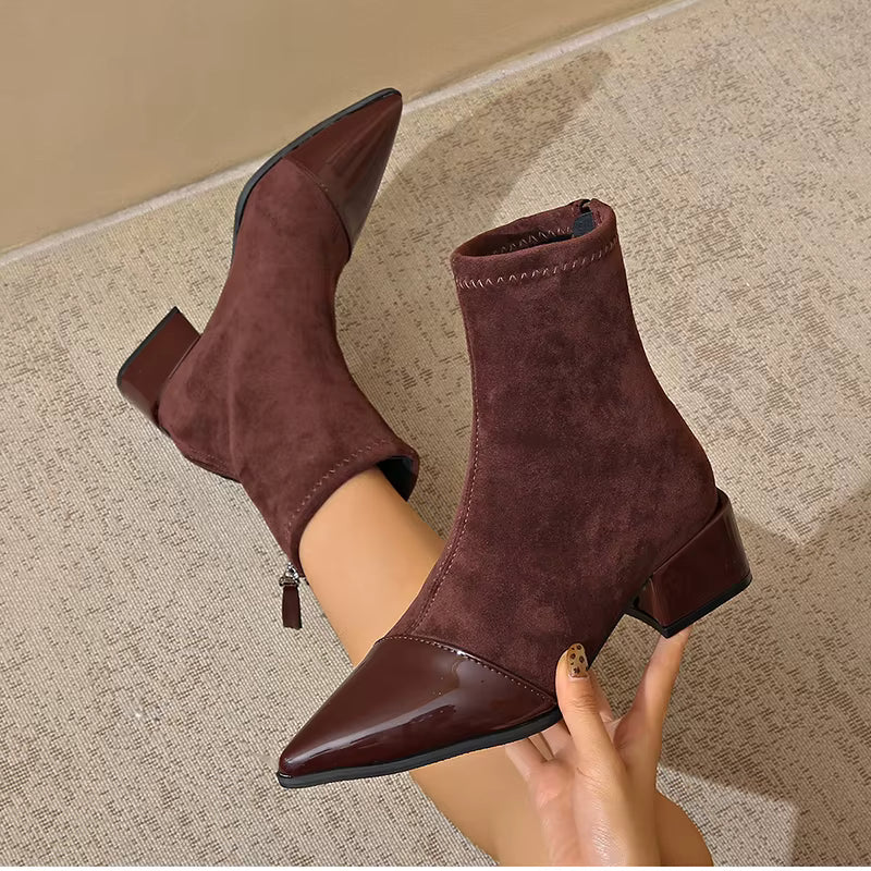 Fashionable women's block heel ankle boots in black, designed for comfortable winter wear.