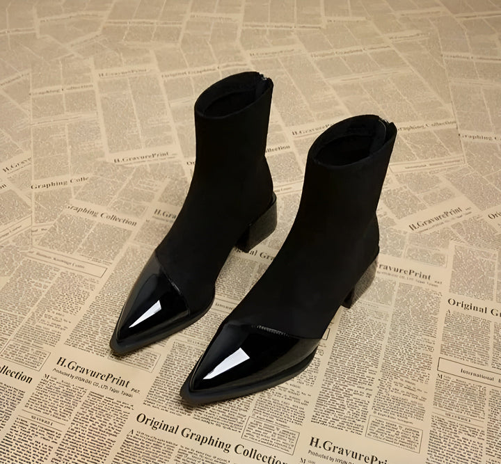 Stylish women's black block heel ankle boots, versatile footwear for winter outfits.