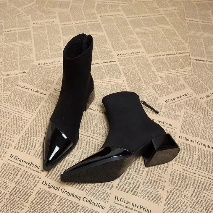 Close-up of a women's brown block heel ankle boot, highlighting texture and design.