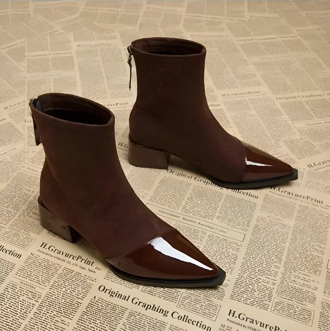 Side profile of a women's brown block heel ankle boot, ideal for winter fashion.