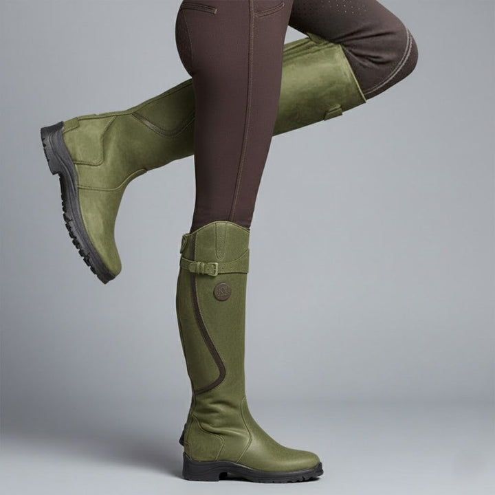 Women's orthopedic leather riding boots with elegant buckle detail, enhancing outdoor fashion