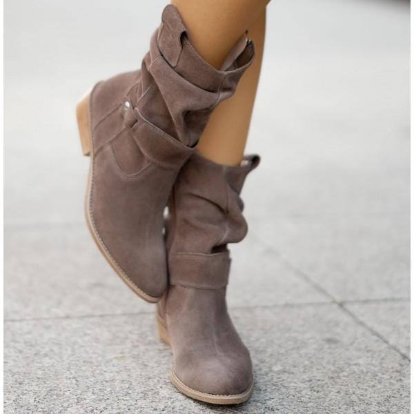 Side profile of women's suede Western ankle boots, showing textured material.
