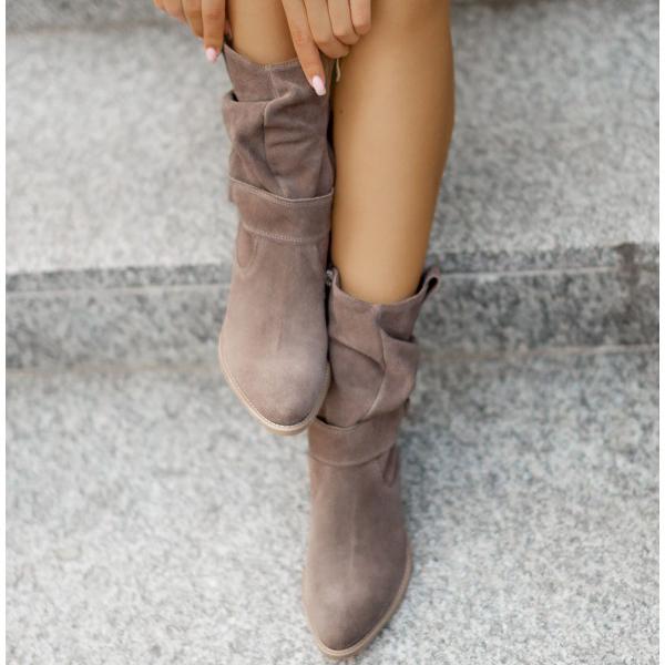 Women's fashionable suede Western ankle boots with an elegant pointed toe.