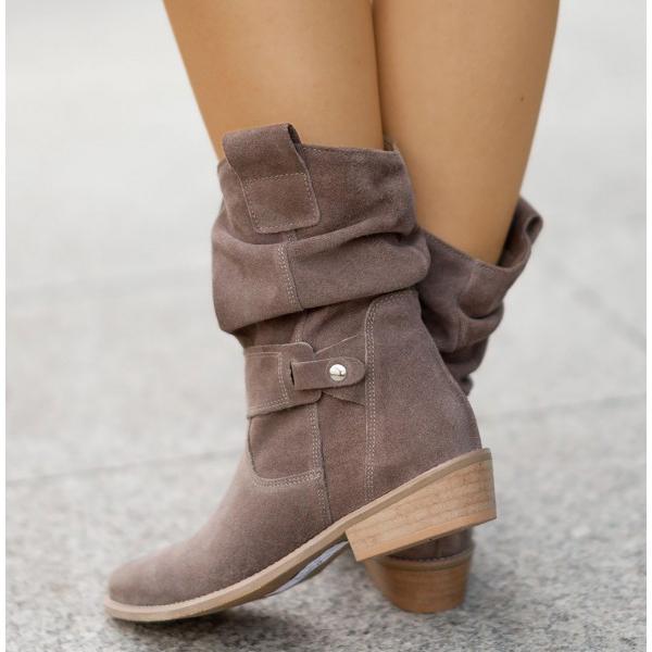 Pair of women's desert tan suede ankle boots, Western style, casual footwear.