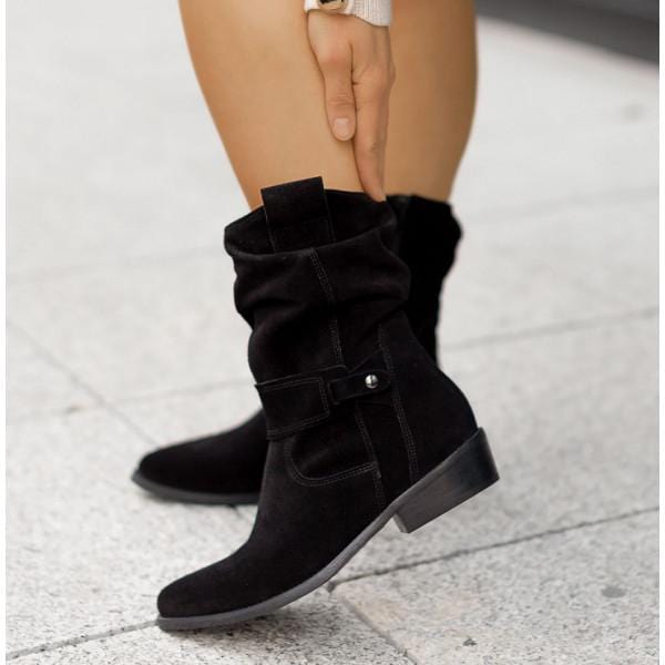 Detailed shot of the stitching on women's Western suede ankle boots.