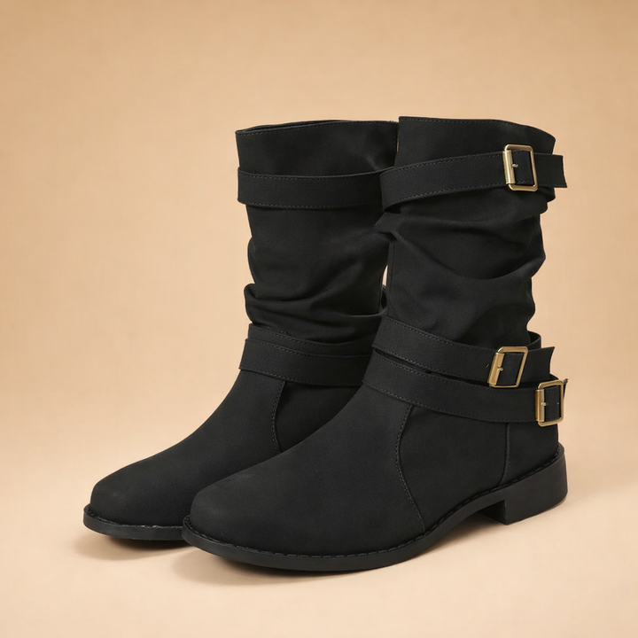 Elegant women's mid-calf boots, featuring multiple buckle straps. Trendy winter fashion and comfortable casual wear.