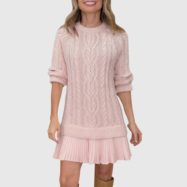 Full body shot of model wearing a long sleeve cable knit sweater dress, casual yet chic.
