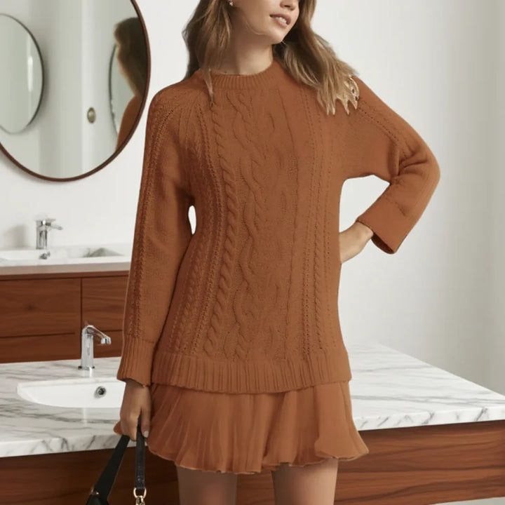 Comfortable women's knitwear: cable knit sweater dress, versatile for various occasions.
