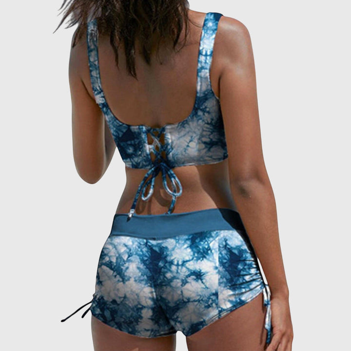 Close-up of camouflage print fabric on a women's two-piece bikini swimsuit