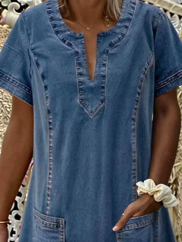 Close-up of the fabric and pocket detail of a blue A-line loose fit summer dress