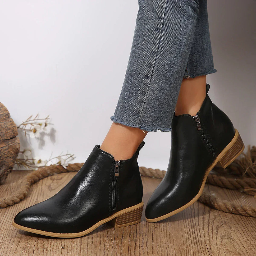 Comfortable gray women's ankle boots featuring a convenient side zipper for easy wear.