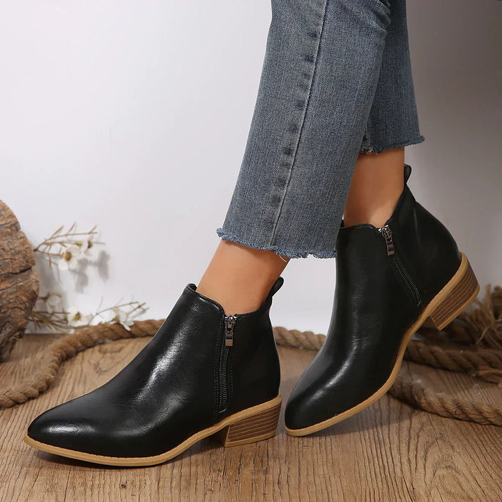 Comfortable gray women's ankle boots featuring a convenient side zipper for easy wear.