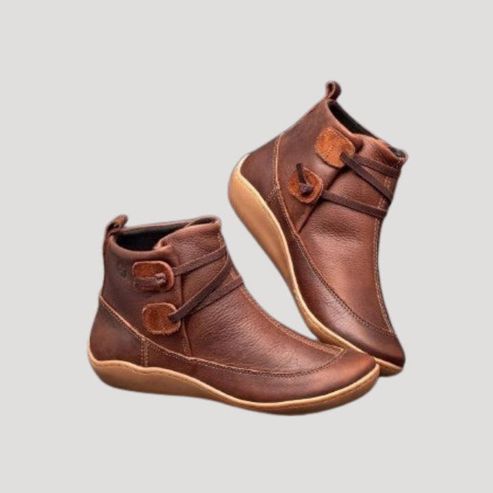 Women's casual ankle strap boots in black leather, perfect for spring everyday wear.
