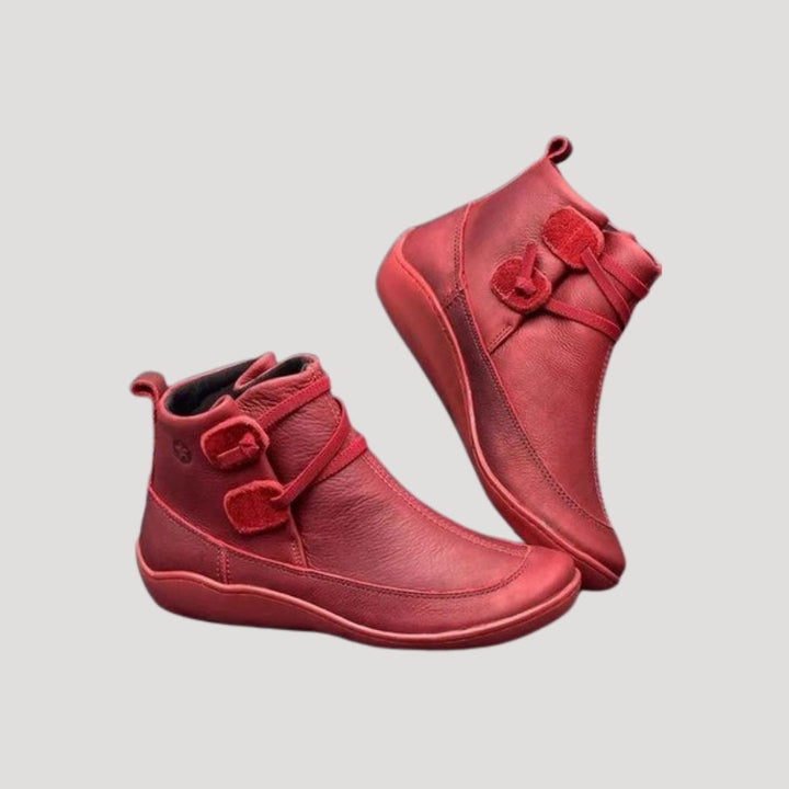 Beige women's ankle strap boots with a low heel, ideal for spring casual fashion.