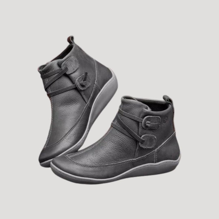 Stylish women's strap ankle boots in brown, offering comfort and versatility for spring.