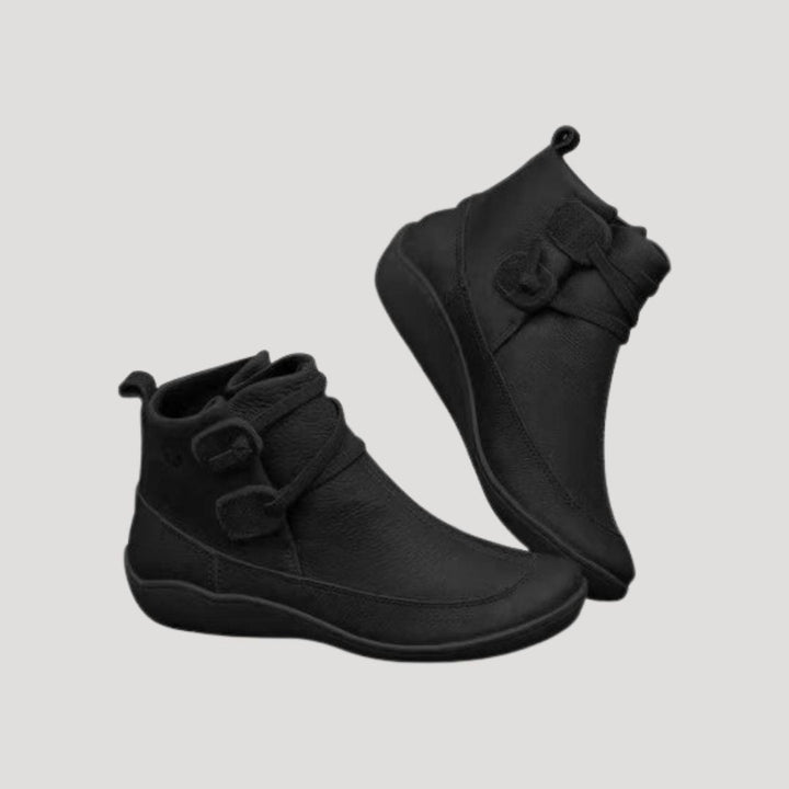Chic women's gray ankle strap boots, a comfortable and versatile spring footwear choice.