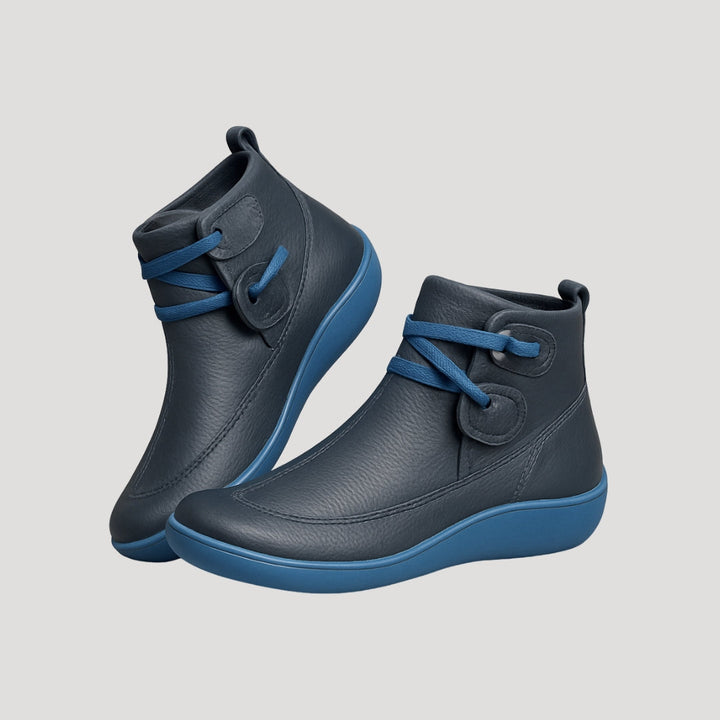 Pair of women's black ankle strap boots, essential comfortable footwear for spring fashion.