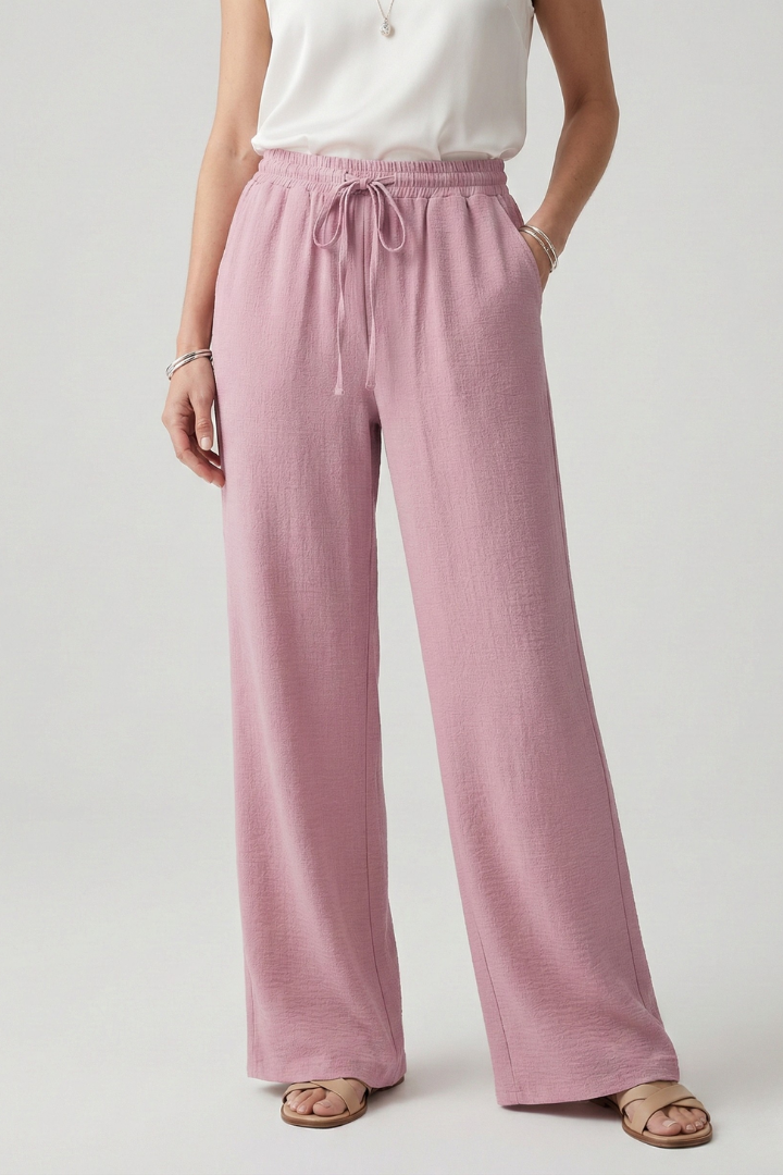 Flowy wide-leg women's palazzo pants in a solid color with an adjustable drawstring waist.