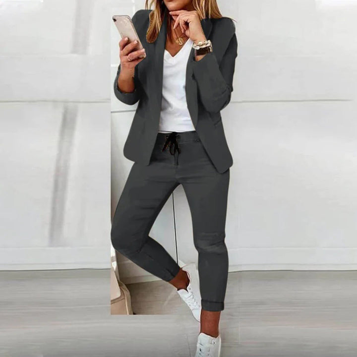 Stylish women's workwear or loungewear blazer and jogger outfit in black.