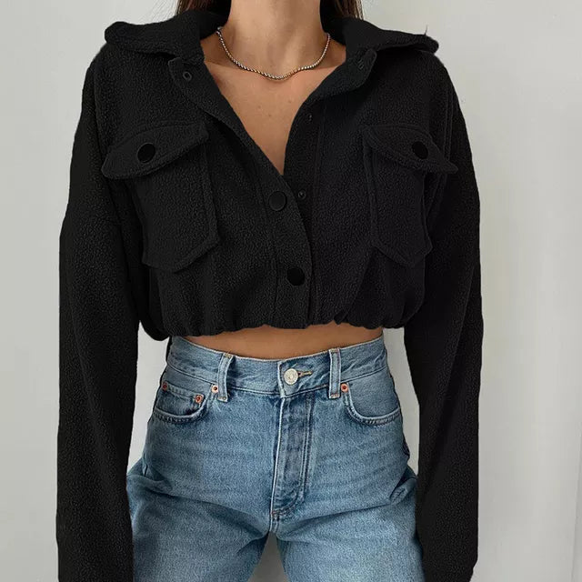 Modern women's outerwear: cropped snap-up jacket, lightweight and versatile for casual fall outfits.