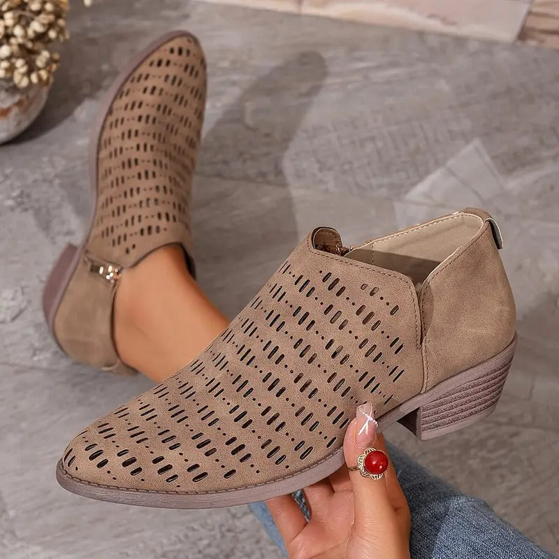 Black slip-on women's cutout ankle boots, ideal for fashion-forward summer shoes
