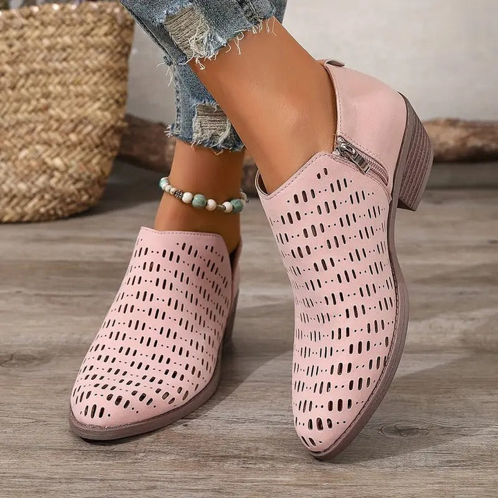 Fashionable women's lightweight ankle boots, featuring cutout details and easy slip-on style