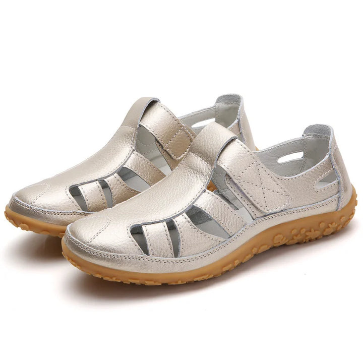 Comfort-focused women's casual sandals with a sturdy flat sole and fashionable cutouts.