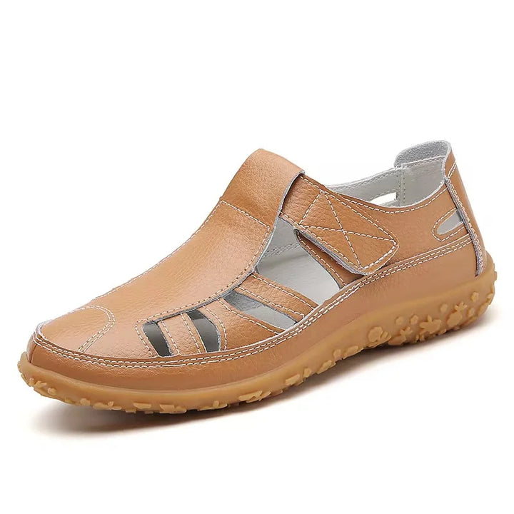 Casual women's flat sandals with intricate cutouts, designed for optimal comfort and breathability.