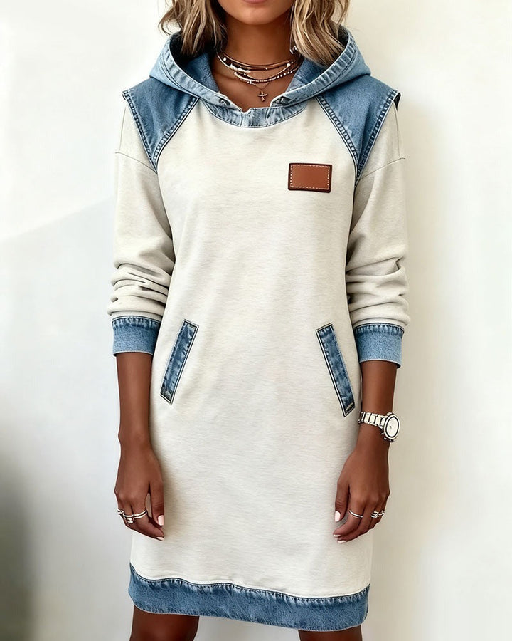 Close-up of the denim fabric on a women's casual hoodie dress, quality texture