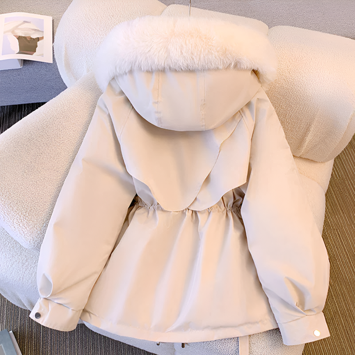 Stylish women's winter coat featuring a drawstring waist and cozy faux fur collar, a warm fashion statement
