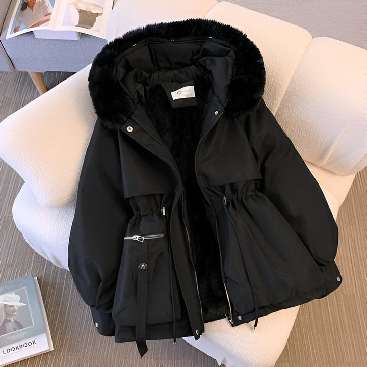Warm outerwear: a women's collared winter coat with an adjustable drawstring waist and elegant faux fur collar