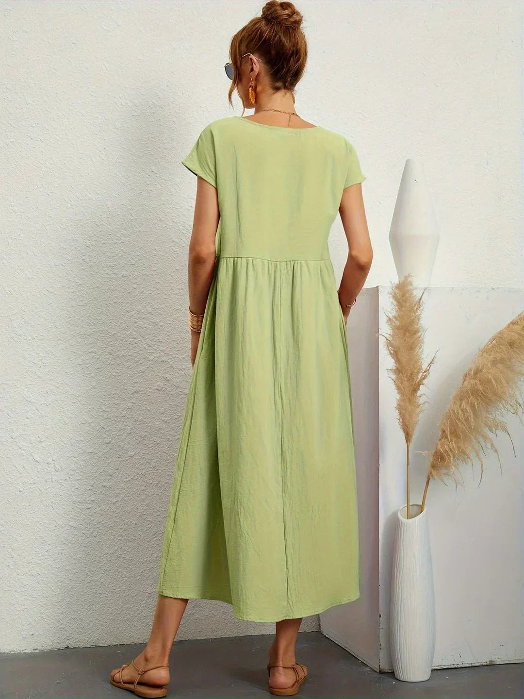 Midi length women's dress, combines casual comfort with elegance.